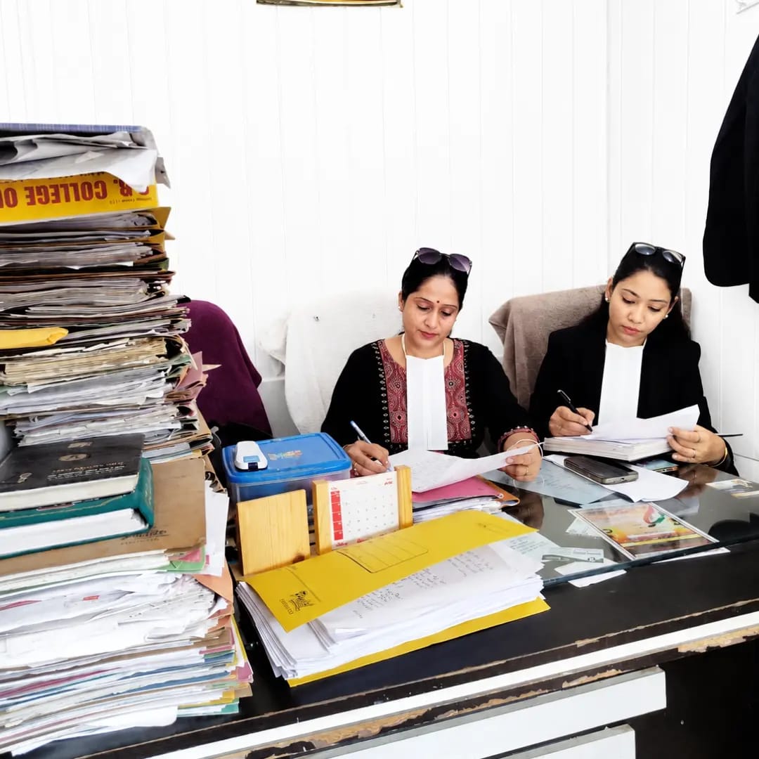 Advocates at Tyagi & Associates reviewing case files together in chamber